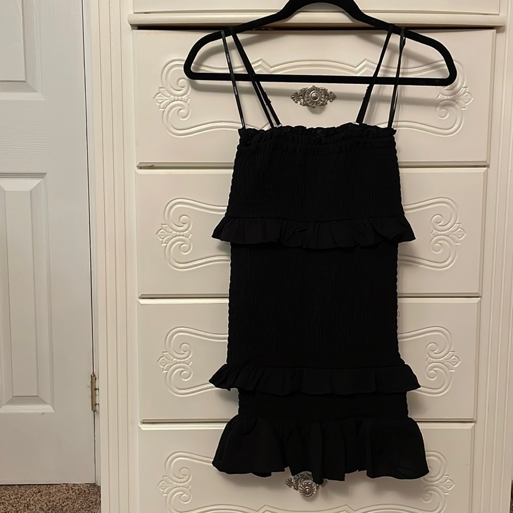 Black fitted dress with tiered ruffles